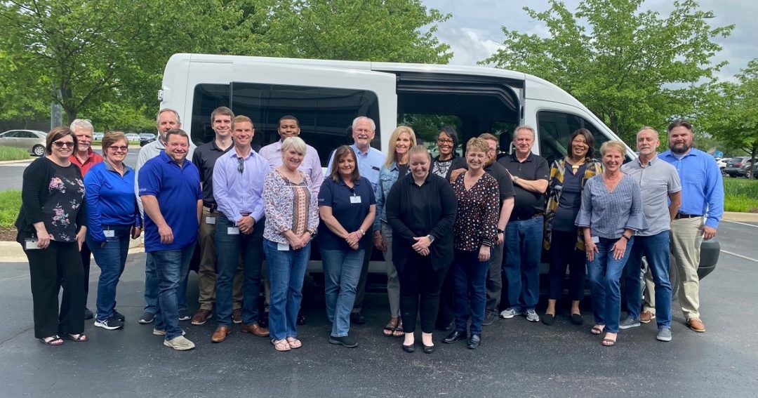 FORUM Employees with Newly Donated Dayspring Van.jpg